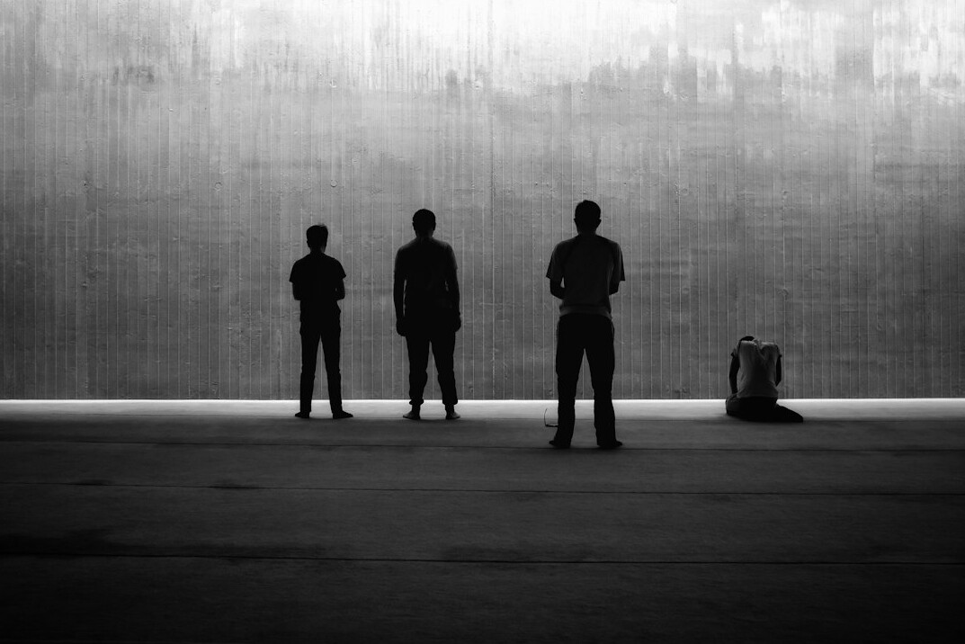 Group portrait of four professional editorial colleagues