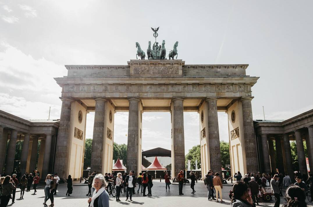 Brandenburg Gate in Berlin under a cloudy sky